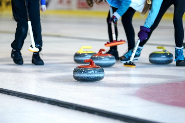 Curling stones and brooms